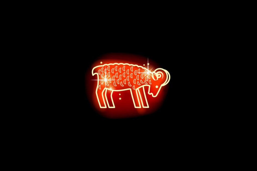 Ilustração em vermelho neon do signo de Áries em um fundo preto 