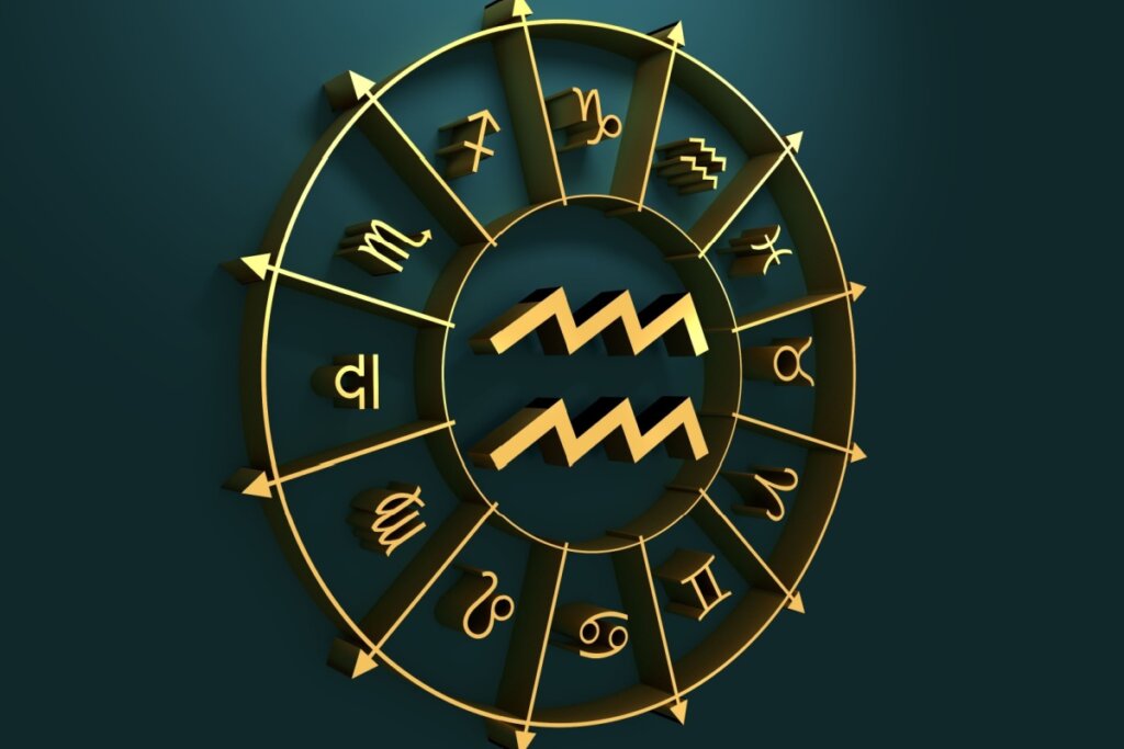 círculo em amarelo com símbolo dos 12 signos em volta, separados por flechas, com símbolo do signo de aquário no centro, sobre fundo verde-escuro