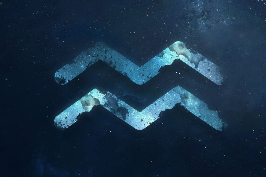 símbolo do signo de aquário em fundo azul marmorizado sobre fundo azul-escuro estrelado