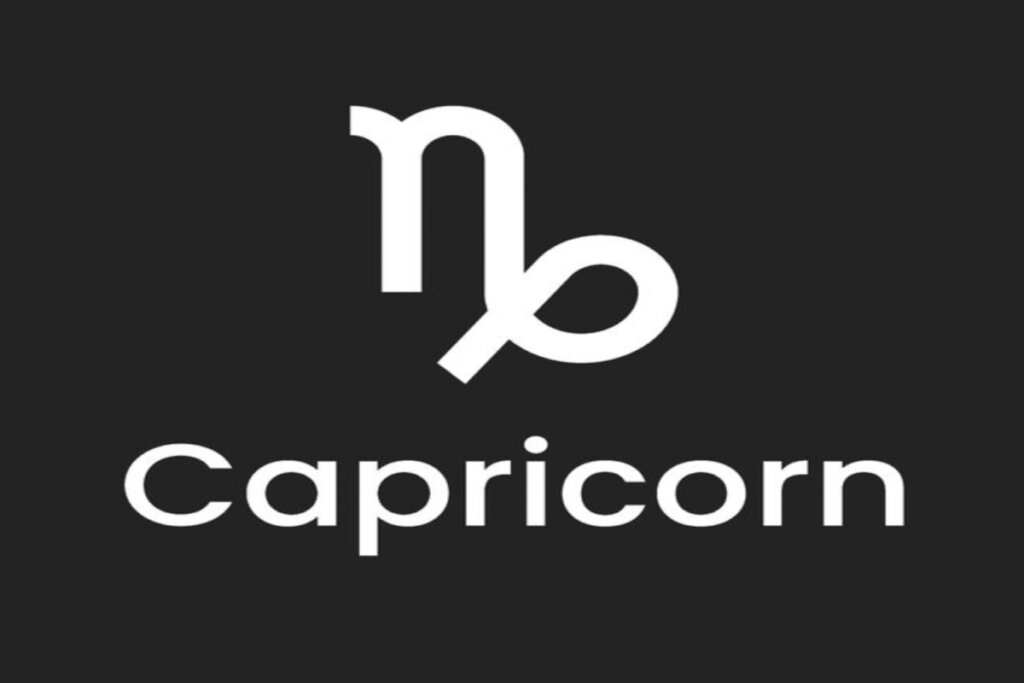 Símbolo e nome do signo de capricórnio em fundo preto