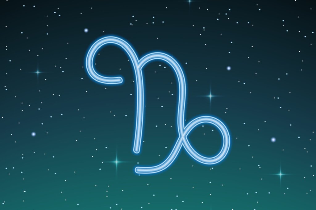 ilustração azul do símbolo de capricórnio sobre fundo esverdeado com estrelas