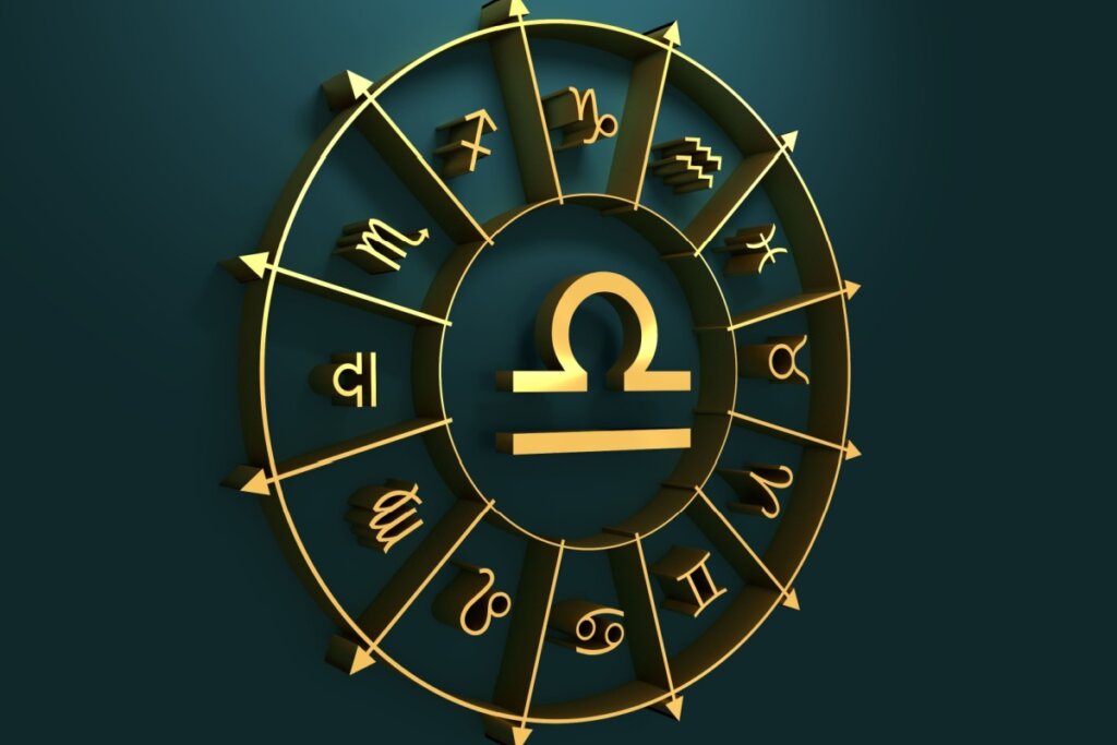 círculo em amarelo com símbolo dos 12 signos em volta, separados por flechas, com símbolo do signo de libra no centro, sobre fundo verde-escuro
