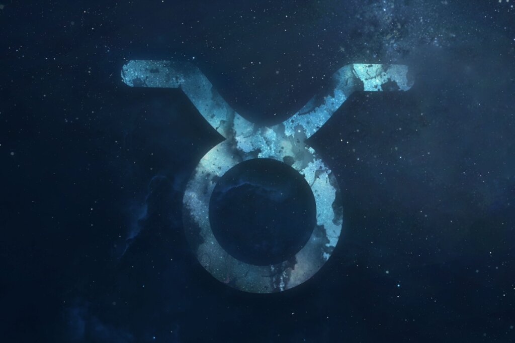 símbolo do signo de touro com um fundo marmorizado azul sobre fundo azul-escuro estrelado